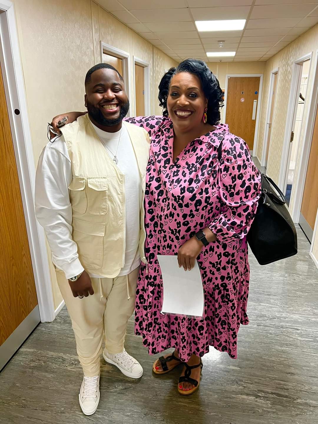 Bash The Entertainer Standing With His Mother For A Picture